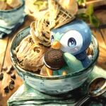  artist_name blue_eyes bowl chocolate commentary eating fluffybiscotti food food-themed_hat ice_cream ice_cream_cone leaf no_humans oreo piplup pokemon pokemon_(creature) pokemon_focus sitting spoon 