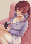  1girl breasts cleavage collarbone controller couch game_controller highres holding holding_controller holding_game_controller hololive houshou_marine large_breasts looking_at_viewer medium_hair multicolored multicolored_eyes pajamas red_hair sitting tongue two_side_up virtual_youtuber yamikyon 