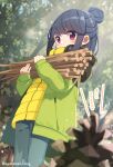  1girl :o ayataka bangs black_hair blue_pants blurry blurry_foreground blush carrying commentary_request day depth_of_field eyebrows_visible_through_hair green_jacket hair_bun highres jacket long_sleeves open_clothes open_jacket outdoors pants parted_lips pinecone red_eyes shima_rin sleeves_past_wrists solo standing stick translation_request tree twitter_username yellow_jacket yurucamp 