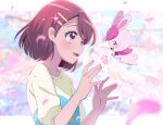  1girl :d asymmetrical_hair blue_shirt blurry blurry_background blush border brown_hair bunny buttons cherry_blossoms depth_of_field floating_hair flower flower_(symbol) from_side hair_flower hair_ornament hanadera_nodoka hands_up healin&#039;_good_precure healing_animal juugoya_neko letterboxed long_sleeves looking_at_another multicolored_shirt open_mouth outside_border paw_print petals pink_eyes precure rabirin_(precure) shirt short_hair sideways_mouth sleeves_pushed_up smile sparkle symbol_commentary two-tone_shirt upper_body white_border white_shirt wind 