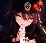  1girl :p bangs black_headwear black_nails blush brown_hair commentary eyebrows_visible_through_hair eyes_visible_through_hair fingernails flower flower-shaped_pupils genshin_impact hair_between_eyes hat hat_flower hu_tao implied_fellatio jewelry long_hair long_sleeves looking_at_viewer orange_eyes plum_blossoms ricegnat ring smile solo symbol_commentary tongue tongue_out upper_body 