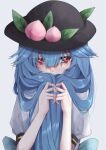  1girl blue_hair fall_dommmmmer food fruit hat highres hinanawi_tenshi long_hair looking_at_viewer peach red_eyes solo touhou upper_body 