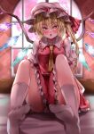  1girl :o absurdres bad_feet bangs blurry blurry_background blush breasts commentary_request crystal eyebrows_visible_through_hair feet flandre_scarlet frilled_shirt_collar frills glint hair_between_eyes hat hat_ribbon highres indoors knees_up looking_at_viewer maboroshi_mochi medium_breasts mob_cap necktie no_shoes on_bed one_side_up open_mouth orange_eyes petticoat puffy_short_sleeves puffy_sleeves red_ribbon red_skirt red_vest ribbon short_hair short_sleeves sitting skirt skirt_set socks soles solo touhou vest wall white_headwear white_legwear window wings yellow_neckwear 