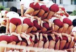  ass bent_over buruma gym_uniform human_tower lineup multiple_girls photo pyramid stacking 
