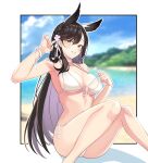  1girl animal_ears armpits atago_(azur_lane) atago_(midsummer_march)_(azur_lane) azur_lane bangs bare_legs beach bikini blue_sky blurry blurry_background blush breasts brown_hair cleavage closed_mouth cloud cloudy_sky commentary day eyebrows_visible_through_hair eyelashes flower hair_between_eyes hair_flower hair_ornament highres knees_together_feet_apart large_breasts long_hair looking_at_viewer mole mole_under_eye navel ocean official_alternate_costume outdoors outline outside_border parted_bangs pink_flower side-tie_bikini sitting sky smile solo straight_hair string_pull swimsuit thighs white_bikini wristband xiaoxiao_de_kuangsan yellow_eyes 