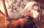  1girl armor armored_dress chain fate/grand_order fate_(series) fire flag gorogoronemuri headpiece highres holding holding_flag jeanne_d&#039;arc_(alter)_(fate) jeanne_d&#039;arc_(fate)_(all) short_hair silver_hair solo upper_body yellow_eyes 