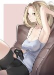  1girl armpits azur_lane black_shorts blonde_hair breasts brown_eyes bunker_hill_(azur_lane) bunker_hill_(mission_relaxation)_(azur_lane) controller dualshock eyebrows_visible_through_hair game_controller gamepad hair_ornament hand_in_hair holding holding_controller long_hair looking_at_viewer medium_breasts on_bed ootani_nonno playstation_controller shirt shorts simple_background sitting sitting_on_bed solo white_shirt 