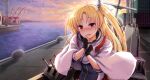  1girl azur_lane bangs black_gloves blonde_hair blush capelet cleveland_(azur_lane) cloud cloudy_sky commentary_request dock embarrassed eyebrows_visible_through_hair eyes_visible_through_hair fingerless_gloves gloves horizon long_hair looking_at_viewer machinery one_side_up red_eyes sidelocks sky solo sunrise takeyaman turret twilight 