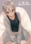  1girl asyde bare_legs black_shirt blue_shorts blush breasts collarbone crossed_legs cushion eyebrows_visible_through_hair grey_background grey_hair grey_jacket hair_between_eyes hands_together highres idolmaster idolmaster_cinderella_girls jacket looking_at_viewer medium_breasts midriff navel shiomi_shuuko shirt short_shorts shorts simple_background sitting sleeves_past_wrists smile solo v_arms 