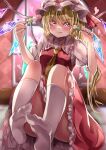  1girl blonde_hair dango dress eating flandre_scarlet food frilled_dress frills hair_between_eyes hat highres kneehighs looking_at_viewer maboroshi_mochi mob_cap red_dress short_sleeves sitting smile solo touhou wagashi white_legwear yellow_eyes 