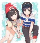  1boy 1girl arm_support bangs baseball_cap beanie black_hair black_headwear bracelet brown_hair capri_pants commentary_request elio_(pokemon) floral_print green_shorts grey_eyes hat jewelry knees pants parted_lips pokemon pokemon_(game) pokemon_sm posunke red_headwear selene_(pokemon) shirt short_shorts short_sleeves shorts sketch smile striped striped_shirt swept_bangs t-shirt tied_shirt 