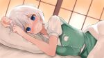  1girl 258n arms_up bangs blanket blue_eyes blurry blurry_background blush breasts closed_mouth depth_of_field dutch_angle eyebrows_visible_through_hair furrowed_eyebrows green_skirt green_vest hair_between_eyes highres hitodama_print indoors konpaku_youmu looking_at_viewer lying medium_breasts no_headwear nose_blush on_bed on_side pillow puffy_short_sleeves puffy_sleeves shirt short_hair short_sleeves silver_hair skirt sliding_doors solo touhou vest wavy_mouth white_shirt 