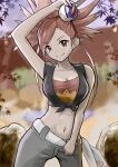  1girl arm_up bangs bare_shoulders black_shirt blurry blurry_background breasts cleavage closed_mouth clothes_pull collarbone commentary cowboy_shot crop_top eyebrows_visible_through_hair flannery_(pokemon) great_ball green_pants gym_leader highres holding holding_poke_ball indoors keita_(kmfirstday) large_breasts long_hair looking_at_viewer midriff navel pants pants_pull poke_ball pokemon pokemon_(game) pokemon_oras ponytail red_eyes red_hair rock shirt sleeveless sleeveless_shirt smile solo standing strapless tied_shirt towel tubetop white_towel 