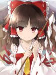  1girl ascot bangs bow brown_hair closed_mouth commentary_request detached_sleeves eyebrows_visible_through_hair frilled_bow frilled_hair_tubes frills gohei hair_bow hair_tubes hakurei_reimu highres holding looking_at_viewer medium_hair nontraditional_miko red_bow red_eyes red_ribbon red_shirt ribbon ribbon-trimmed_bow ribbon-trimmed_sleeves ribbon_trim shirt smile solo touhou tyouseki upper_body white_ribbon wide_sleeves yellow_neckwear 