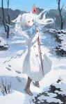  1girl bare_tree boots closed_mouth coat day elf frieren full_body fur_trim hashtag-only_commentary highres holding jacket long_hair long_sleeves mage_staff mountain nature pointy_ears scarf sky snow snowcake47 snowflakes snowing solo sousou_no_frieren standing tree twintails very_long_hair white_coat white_hair winter winter_clothes winter_coat 