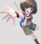  1girl akiyama_yukari backpack bag black_socks blackminolith_(2ne) blurry blurry_foreground brown_eyes brown_hair brown_shorts cargo_shorts casual clothes_writing commentary depth_of_field dog_tags girls_und_panzer grey_background highres looking_at_viewer messy_hair open_mouth pink_shirt reaching reaching_towards_viewer shirt short_hair short_sleeves shorts simple_background smile socks solo standing standing_on_one_leg suspender_shorts suspenders t-shirt 