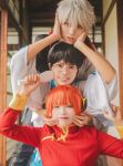  1girl 2boys absurdres aburanaka_tane arms_up black_hair blue_eyes blunt_bangs brown_eyes bun_cover cheek_pinching cheek_pull cheek_squash chinese_clothes comb commentary_request cosplay cosplay_photo double_bun emoemocos gintama glasses grin hair_bun hands_on_another&#039;s_cheeks hands_on_another&#039;s_face hands_up head_on_head head_rest highres holding holding_comb indoors japanese_clothes kagura_(gintama) kagura_(gintama)_(cosplay) kimono lips long_sleeves looking_at_viewer multiple_boys orange_hair parted_lips photo_(medium) photoshop_(medium) pinching red_eyes sakata_gintoki sakata_gintoki_(cosplay) shimura_shinpachi shimura_shinpachi_(cosplay) short_hair smile tangzhuang teeth white_hair wide_sleeves yusura_uni 