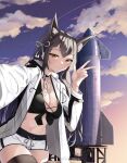  1girl absurdres animal_ear_fluff animal_ears atago_(azur_lane) azur_lane black_choker black_hair black_legwear black_shirt breasts brown_eyes choker cleavage closed_mouth cowboy_shot crop_top extra_ears front-tie_top hand_up highres jacket large_breasts long_hair long_sleeves looking_at_viewer midriff navel open_clothes open_jacket outstretched_arm rocket_ship selfie shirt short_shorts shorts sidelocks smile solo space_craft standing steeb stomach thighhighs thighs v white_jacket white_shorts 