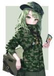  1girl box camouflage camouflage_headwear camouflage_jacket camouflage_print card chest_harness commentary drawstring green_eyes green_hair harness hat high_collar highres holding holding_card jacket key looking_at_viewer medium_hair patrol_cap pocket sideways_hat snap-fit_buckle solo strap torinari_(dtvisu) touhou upper_body yamashiro_takane 