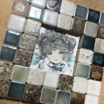  1girl acrylic_paint_(medium) air_bubble blush bubble commentary_request curly_hair double_bun grey_hair hair_bun hair_ornament highres jewelry karintoun looking_at_viewer original painting_(medium) pale_skin photo_(medium) portrait ribbon short_hair simple_background smile traditional_media watercolor_(medium) 