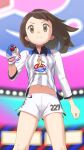  1girl bangs brown_eyes brown_hair closed_mouth collared_shirt commentary eyelashes from_below gloria_(pokemon) gloves gym_challenge_uniform hand_up highres holding holding_poke_ball knees navel number partially_fingerless_gloves poke_ball poke_ball_(basic) pokemon pokemon_(game) pokemon_swsh shiny shiny_skin shirt shorts single_glove smile solo stadium uhyoko white_shorts 