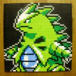  black_background black_eyes claws closed_mouth commentary_request gen_2_pokemon highres lego lego_(medium) no_humans photo_(medium) pixel_art pokemon pokemon_(creature) simple_background solo tyranitar unconventional_media upper_body you_rei_(blowback) 