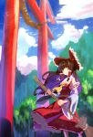 1girl ascot bangs bow broom brown_hair cloud cloudy_sky detached_sleeves frilled_bow frills hair_bow hair_tubes hakurei_reimu highres holding holding_broom japanese_clothes long_hair miko mountainous_horizon multicolored_hair no_lineart red_bow red_eyes ribbon-trimmed_sleeves ribbon_trim shiya sidelocks skirt skirt_set sky solo standing torii touhou two-tone_hair wide_sleeves wind wind_lift yellow_neckwear 