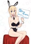  1girl :d absurdres animal_ears black_leotard blonde_hair blue_eyes blush breasts bunny_ears fake_animal_ears feet_out_of_frame flying_sweatdrops hair_bun highleg highleg_leotard highres holding holding_sign kinpatsu-chan_(rucchiifu) large_breasts legs_together leotard looking_at_viewer open_mouth original playboy_bunny rucchiifu sign sitting smile solo translation_request wrist_cuffs 
