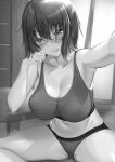  1girl aldehyde bangs black_hair breasts cleavage eyebrows_visible_through_hair greyscale hair_between_eyes highres indian_style indoors large_breasts looking_at_viewer midriff monochrome navel original outstretched_arm parted_lips selfie short_hair sitting smile solo sports_bra table 