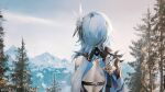  1girl artist_name back_cutout blue_hair capelet clothing_cutout eula_lawrence fantasy from_behind genshin_impact hair_ornament highres medium_hair mountain scenery snow solo sunako_(veera) tree upper_body 