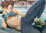  1girl abs ass_visible_through_thighs boxing_ring breasts brown_hair chun-li double_bun hair_ribbon hand_on_own_face lying medium_breasts midriff navel on_side pants ribbon shoes short_hair sneakers solo stomach street_fighter teemu_taiga thighs toned underboob yoga_pants 
