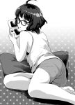 1girl :o ahoge alternate_costume bangs banned_artist barefoot bespectacled blunt_bangs glasses greyscale handheld_game_console holding kantai_collection kishinami_(kancolle) looking_at_viewer makio_(makiomeigenbot) monochrome nintendo_3ds open_mouth pillow playing_games polka_dot polka_dot_background short_hair shorts simple_background sitting solo tank_top 