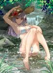  1girl anklet arm_up armpits ass bangs bare_shoulders bikini blush braid breasts cleavage collarbone fate/grand_order fate_(series) flower grass hair_ribbon hat hat_flower hibiscus highres jewelry kama_(fate) knees_together_feet_apart knees_up kuroaki large_breasts legs long_hair looking_at_viewer red_eyes ribbon side_braid silver_hair sitting smile solo straw_hat stream swimsuit water white_bikini 