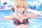  1girl artoria_pendragon_(all) bangs bare_shoulders bikini black_bikini blonde_hair blush braid breasts cleavage fate/grand_order fate/stay_night fate_(series) food french_braid hair_bun highres long_hair looking_at_viewer medium_breasts pool popsicle saber_alter sidelocks solo spider_apple swimsuit thighs yellow_eyes 