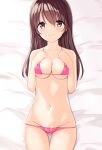  1girl absurdres bed_sheet bikini breasts brown_hair commentary_request groin highres long_hair looking_at_viewer lying marui_koishi medium_breasts navel on_back original pink_bikini smile swimsuit yellow_eyes 