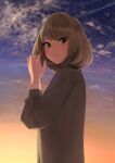  1girl arms_up blue_eyes blush cloud commentary_request eyebrows_visible_through_hair fringe_trim green_eyes heterochromia highres holding idolmaster idolmaster_cinderella_girls leaf looking_at_viewer mole mole_under_eye senju_(snz0) short_hair sky solo sunset takagaki_kaede 