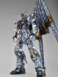  char&#039;s_counterattack clenched_hands fin_funnels gundam gunpla highres looking_down mecha mobile_suit model_kit no_humans nu_gundam photo_(medium) plamo science_fiction solo stained_glass standing sui_(sui4121) v-fin 