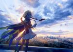  1girl braid capelet cityscape cloud dress feet_out_of_frame highres hood hood_up hooded_capelet kaf kamitsubaki_studio kazuharu_kina long_hair long_sleeves looking_at_viewer looking_back multicolored multicolored_eyes parted_lips photo_background pink_hair see-through side_braid single_braid sky solo sunrise virtual_youtuber 