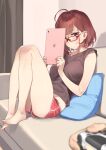  1girl 92m ahoge barefoot black_tank_top brown_hair couch cushion dolphin_shorts glasses highres ipad original playstation_controller red-framed_eyewear red_shorts short_hair short_shorts shorts sitting tablet_pc tank_top 