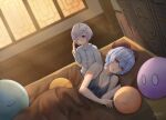  2girls alternate_costume amulet bangs bed bed_sheet blanket blue_hair blurry breasts cleavage coin_hair_ornament collarbone commentary_request damon_ct depth_of_field eyebrows_visible_through_hair ganyu_(genshin_impact) genshin_impact hair_between_eyes highres horns long_hair looking_at_viewer lying multiple_girls ofuda on_side one_eye_closed orange_eyes pajamas parted_lips pillow purple_hair qiqi_(genshin_impact) red_eyes sidelocks sitting slime_(genshin_impact) sunlight under_covers waking_up window 