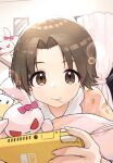  1girl absurdres brown_eyes brown_hair candy carrot_print food food_print girls_und_panzer highres lollipop lying mouth_hold nintendo_switch on_stomach oshiri_seijin pajamas playing_games sawa_azusa short_hair smile solo stuffed_animal stuffed_bunny stuffed_toy 