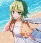  1girl beach bird blurry blurry_foreground commentary dress green_eyes green_hair grin gumi hand_in_hair hand_up highres jacket lens_flare looking_at_viewer ocean orange_jacket seagull seashell shell shell_necklace short_hair_with_long_locks short_sleeves sidelocks smile solo upper_body vocaloid white_dress zhi_(yammycheese) 