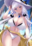  1girl azur_lane bangs bare_arms bare_shoulders bikini blue_eyes blush braid breasts cameltoe cleavage closed_mouth collarbone cowboy_shot eyebrows_visible_through_hair hair_ornament hand_up hat highres illustrious_(azur_lane) large_breasts large_hat long_hair looking_at_viewer mole mole_under_eye navel outdoors palm_tree silver_hair smile solo sun_hat swimsuit tree wee_(weeyy) white_bikini white_headwear 