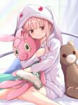  animal_ears bangs bear bear_ears bed bed_sheet blush bunny bunny_ears closed_mouth cosplay highres kyubey kyubey_(cosplay) long_sleeves magia_record:_mahou_shoujo_madoka_magica_gaiden mahou_shoujo_madoka_magica pink_hair red_eyes rikopin sleepwear stuffed_toy tamaki_iroha white_curtains 