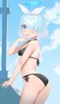  1girl arona_(blue_archive) ass black_swimsuit blue_archive blue_eyes blue_hair blush breasts cloud commentary_request hair_over_one_eye halo headband highres looking_at_viewer nekoshoko open_mouth short_hair sky small_breasts solo swimsuit 