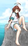  1girl aaoi ahoge blue_sky brown_eyes brown_hair cloud day green_sailor_collar horizon huge_ahoge kantai_collection kuma_(kancolle) long_hair neckerchief ocean outdoors red_neckwear rock sailor_collar school_uniform serafuku short_sleeves shorts sitting sky solo white_shorts 