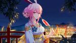  1065587906 1girl animal_ears bangs bridge bunny_ears closed_mouth fan fireworks floral_print flower hair_bun hair_flower hair_ornament highres holding holding_fan honkai_(series) honkai_impact_3rd japanese_clothes kimono lantern looking_at_viewer night night_sky obi outdoors paper_fan pink_hair purple_eyes sash sidelocks sky smile solo torii tree uchiwa yae_sakura 