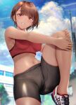  1girl bike_shorts blush bra breasts cloud dark_skin eyebrows_visible_through_hair gentsuki highres long_hair looking_at_viewer medium_breasts midriff monochrome navel original outdoors parted_lips red_bra shoes short_hair sky smile sneakers solo sports_bra standing standing_on_one_leg sweat underwear 