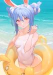  1girl :o alternate_hairstyle animal_ear_fluff animal_ears bangs bare_arms bare_shoulders beach blue_hair blush breasts casual_one-piece_swimsuit collarbone covered_navel cowboy_shot day double_bun eyebrows_visible_through_hair gawain_(artist) hand_in_hair hand_up highres hololive innertube looking_at_viewer multicolored_hair one-piece_swimsuit outdoors parted_lips pink_eyes rabbit_ears small_breasts solo swimsuit thick_eyebrows two-tone_hair usada_pekora virtual_youtuber water white_hair white_swimsuit 
