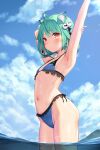  1girl ahoge animal_ears armpits bangs bikini blue_bikini blush cat_ears caustics day double_bun flat_chest green_hair hair_ornament highres hololive navel outdoors red_eyes revision shiny shiny_hair shiny_skin short_hair sidelocks skull_hair_ornament solo standing swimsuit uruha_rushia virtual_youtuber wet yasuyuki 